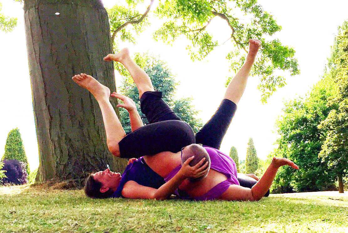two dancers under an old tree legs up and intertwined, at Bethlem (Bedlam)
